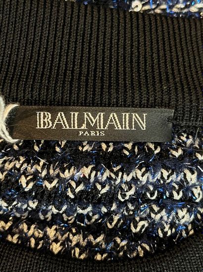 BALMAIN Paris.

Pull à manches courtes réalisé...