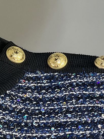 BALMAIN Paris.

Pull à manches courtes réalisé...