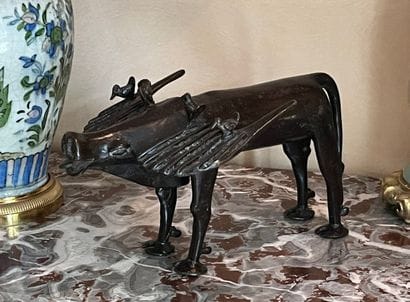 Zoomorphic quadruped in patinated bronze,...