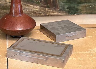 Two silver-plated metal and brass cigar boxes...