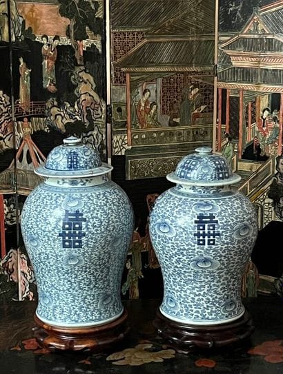 Pair of polychrome enameled porcelain jars...