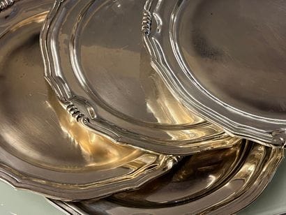 Five plates in silver-plated metal, the rim...