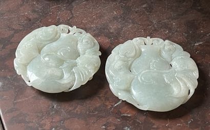 Two jade medallions, with carved decoration...