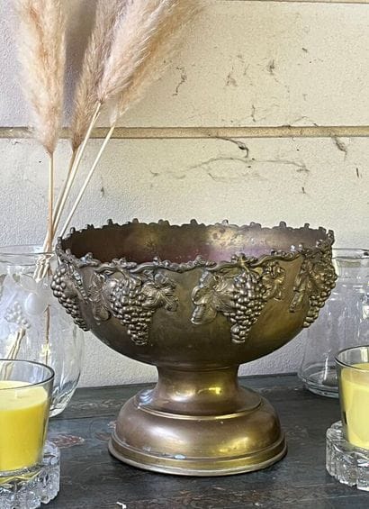 Brass bottle cooler decorated with grapevines...