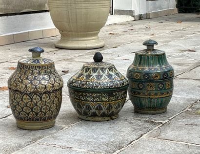 Three covered pots in polychrome enamelled...