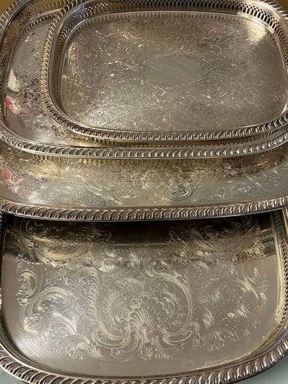 Suite of four silver-plated trays with engraved...