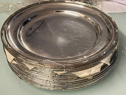 Eighteen silver plated plates decorated with...