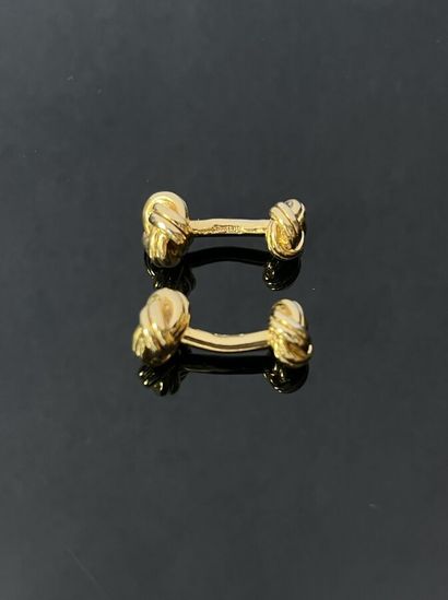 Paire de boutons de manchettes en métal doré...