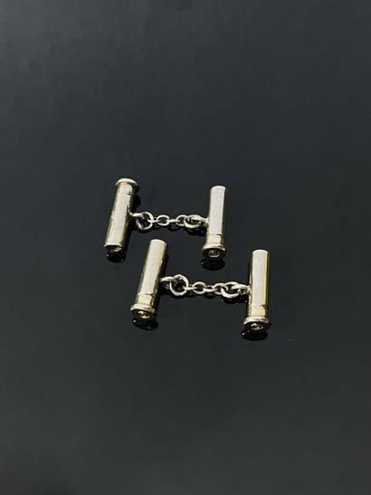 Paire de boutons de manchettes en métal représentant...