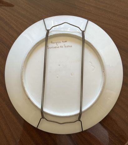 Assiette en porcelaine représentant un paysage...