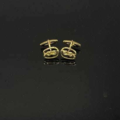GUCCI - Paire de boutons de manchettes figurant...