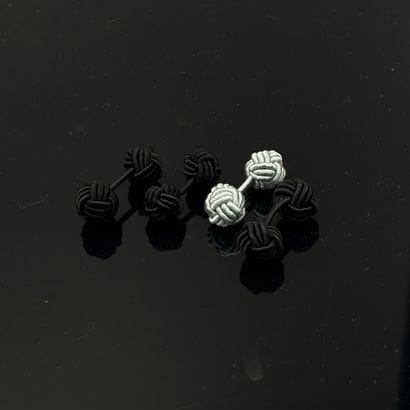 Paire de boutons de manchette en passementerie...