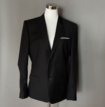 THE KOOPLES - Veste blazer en laine noire.
Fermeture...