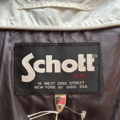 SCHOTT - Doudoune blanche et noire. 
Fermeture...