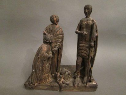 Groupe en bois sculpté représentant un notable...