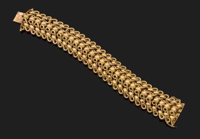 BRACELET articulé en or jaune 18k (750 millièmes)...