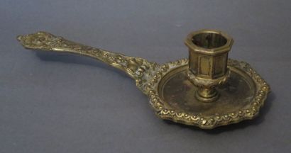 Bougeoir à main en bronze doré et ciselé...