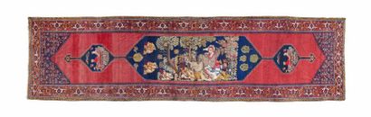 Grand tapis d'orient en laine à fond rouge...