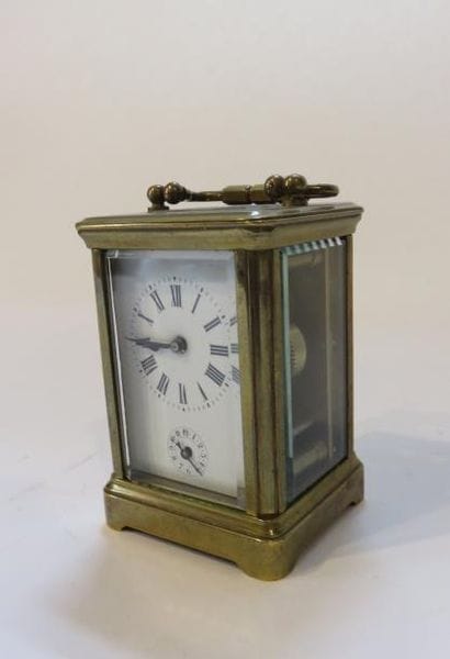 Pendulette reveil cage en bronze mouluré...