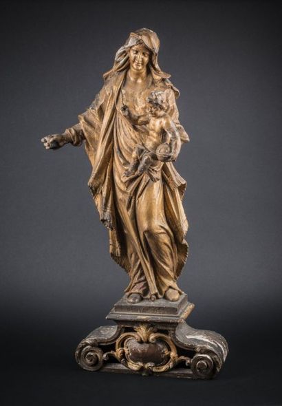 Vierge à l?Enfant en bois doré reposant sur...