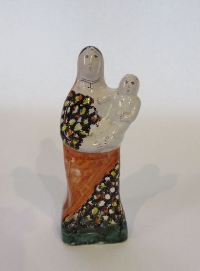 Vierge à l'Enfant en faïence polychrome,...