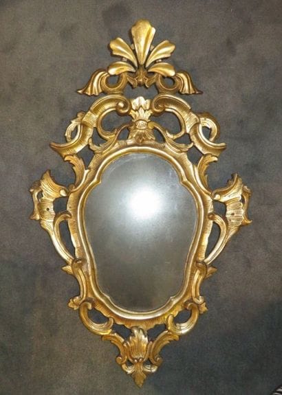 Miroir à encadrement violoné et ajouré en...