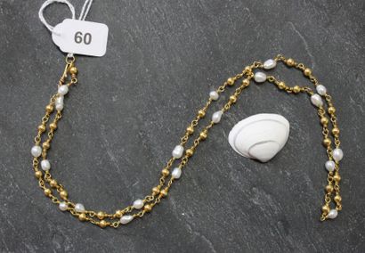 Collier en or jaune 750 ‰ composé de perles...