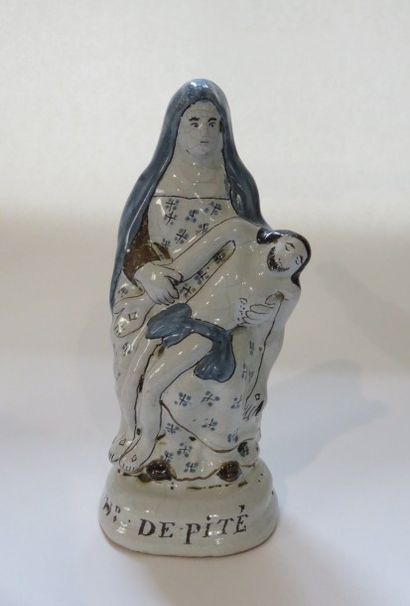 Notre Dame de Pitié en faïence polychrome,...