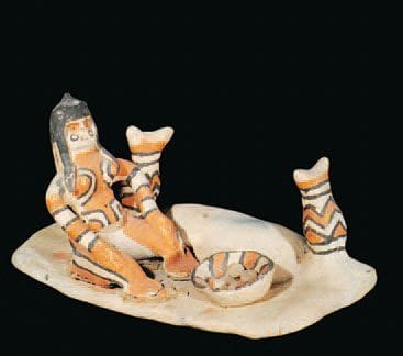 Petite scène Femme assise à côté d'un four...