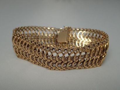 Bracelet à mailles articulées en or jaune...