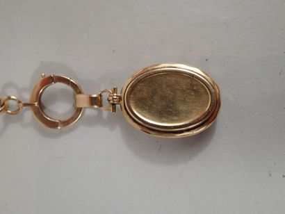 Médaillon souvenir en or jaune 18K chiffré...