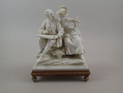 Groupe en biscuit figurant un couple assis...