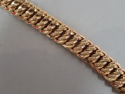 Bracelet maille américaine en or jaune.

Poids...