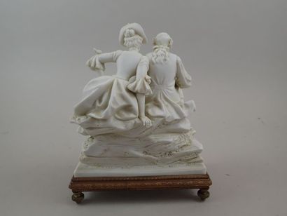 Groupe en biscuit figurant un couple assis...