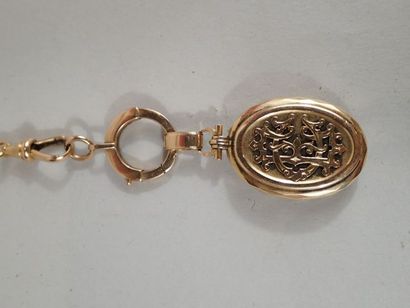 Médaillon souvenir en or jaune 18K chiffré...