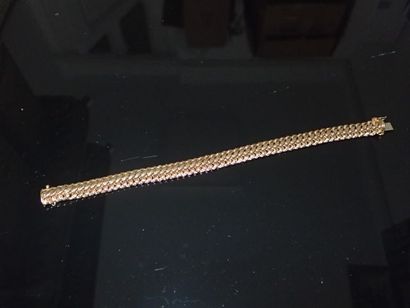 Bracelet en or jaune, mailles américaines.

P...