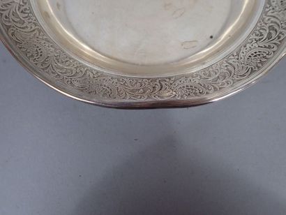 Dessous de bouteille en argent, l’aile à...