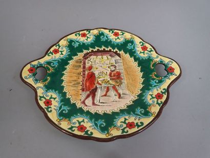 LONGWY. Plat à anses en faïence polychrome...