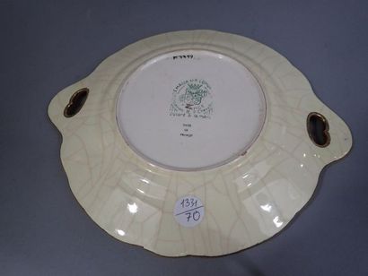 LONGWY. Plat rond à bords polylobés et à...