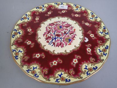 LONGWY. Plat rond en faïence polychrome et...