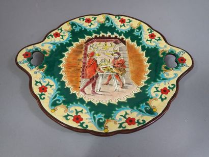 LONGWY. Plat à anses en faïence polychrome...