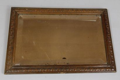 Miroir en verre biseauté dans un cadre en...