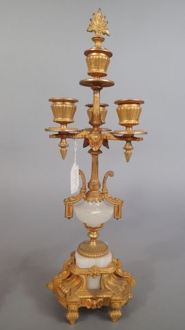 Paire de candélabres en métal doré à trois...