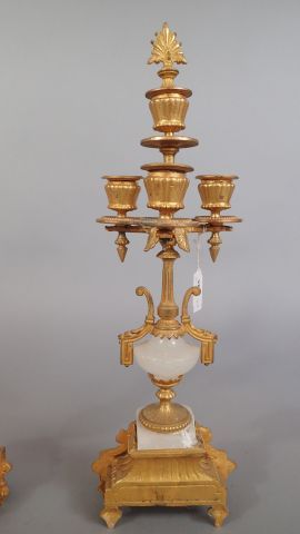 Paire de candélabres en métal doré à trois...