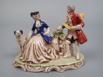 Deux groupes en porcelaine polychrome et...