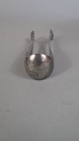 Ensemble en argent comprenant une pince à...