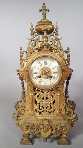 Garniture de cheminée composée d'une pendule...
