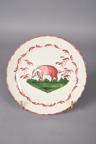 Les ISLETTES. Assiette en faïence polychrome...