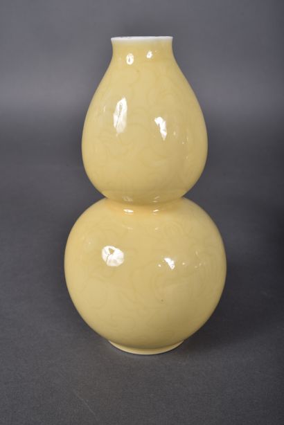 A pair of pale yellow porcelain double gourd...