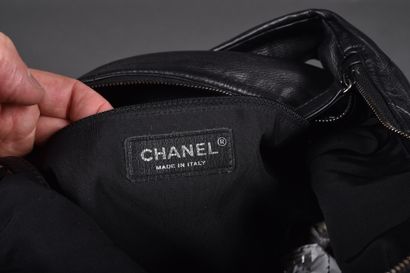 CHANEL.
Girl bag in black leather and iridescent...